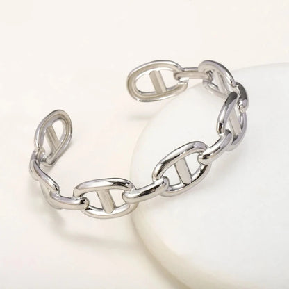 Titanium - Steel Gold - Plated C - Shaped Open - Ended Bangle. A Unique, Irregularly Spliced And Niche Accessory For Women.