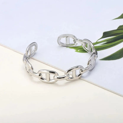 Titanium - Steel Gold - Plated C - Shaped Open - Ended Bangle. A Unique, Irregularly Spliced And Niche Accessory For Women.